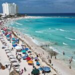 Cancún turistas playa inversión turística